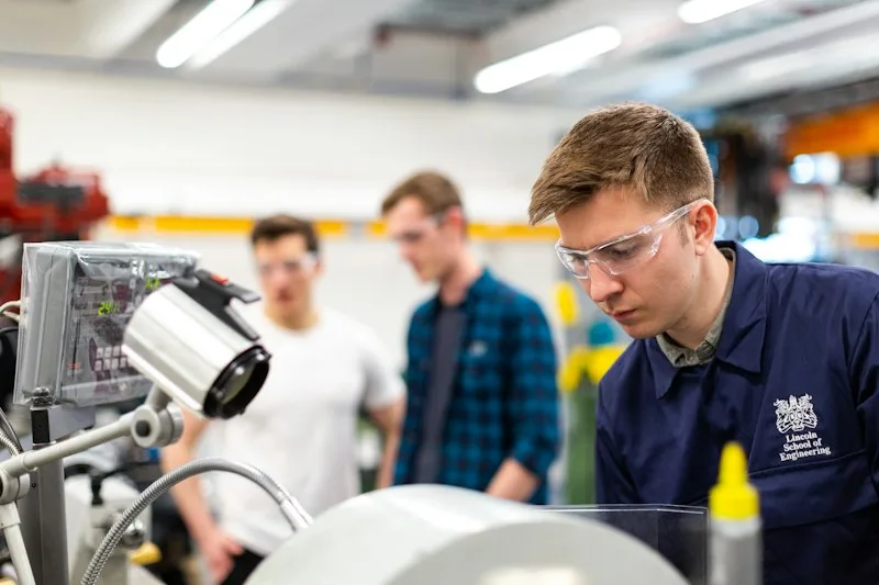 Bradford Appliance Repair Technician Servicing Machine